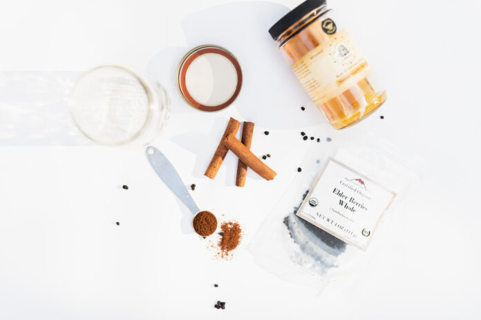 flatlay-of-elderberries-honey-cinnamon-sticks