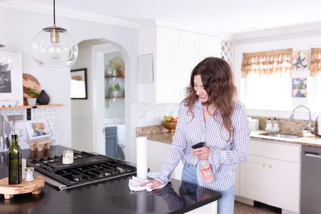 woman-cleaning-kitchen-countertop