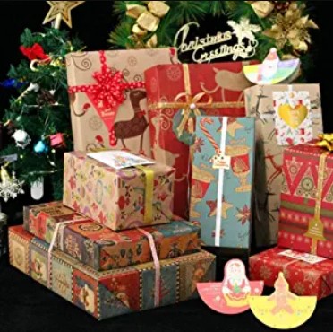 Eco-Friendly Christmas Wrapping Paper - wrapped Christmas presents with ribbons in different recycled wrapping paper