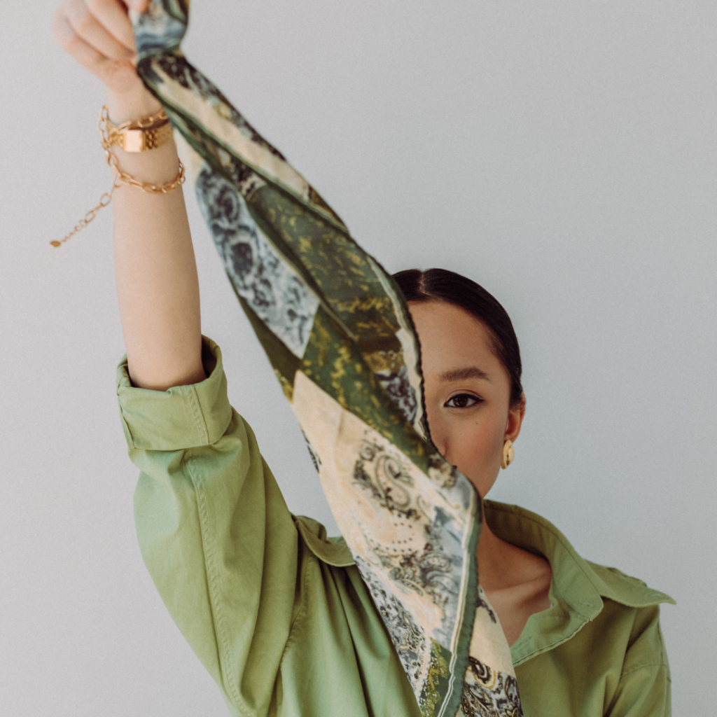 Eco-Friendly Christmas Wrapping Paper - woman holding up a green and cream silk scarf