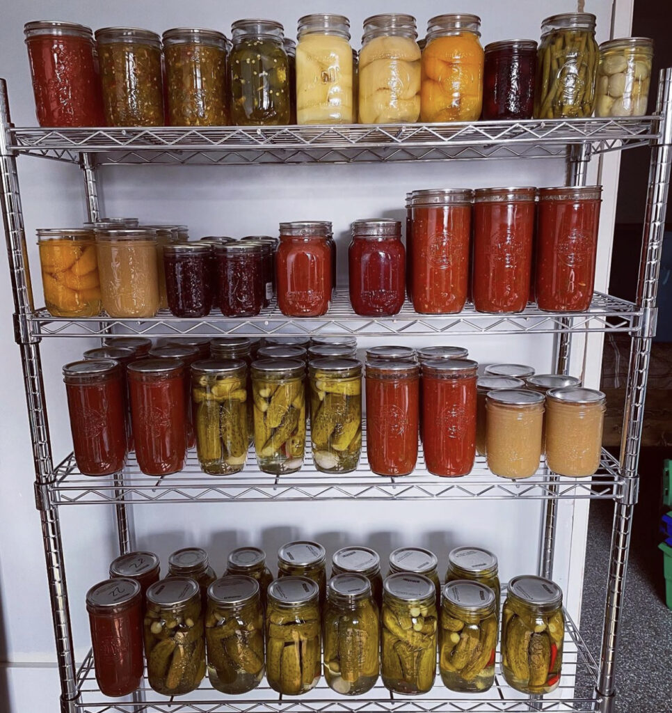 How to Can Vegetables - Pantry shelves full of canned vegetables and sauces